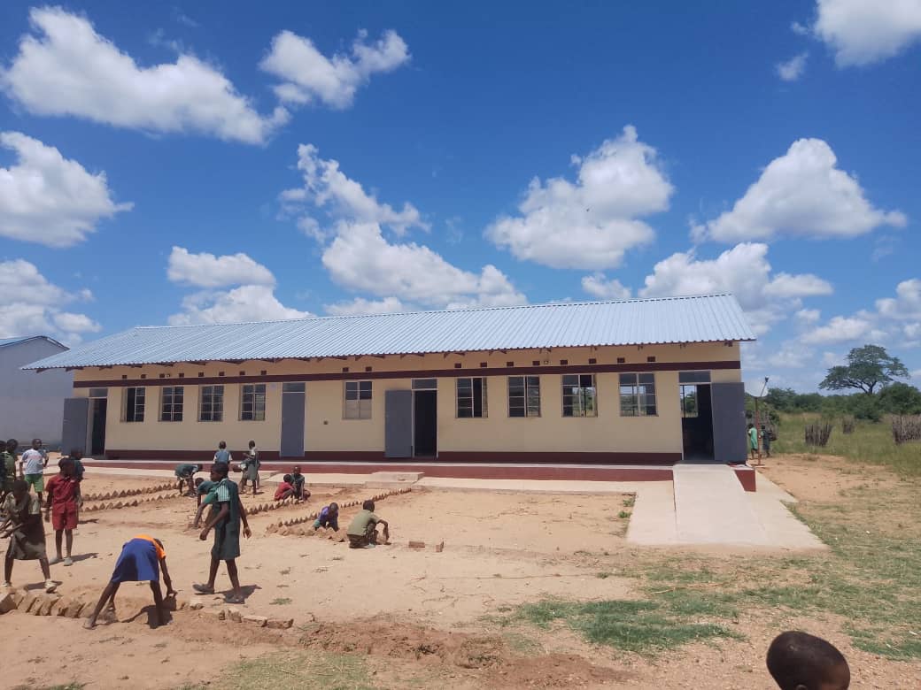 New school building with children outside