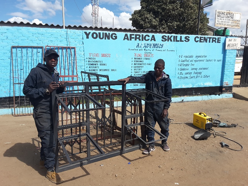 Skills centre training equipment outside a blue building